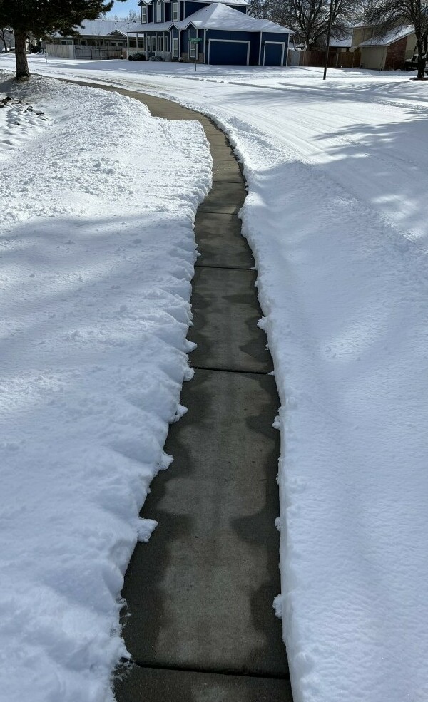 a path with snow around it