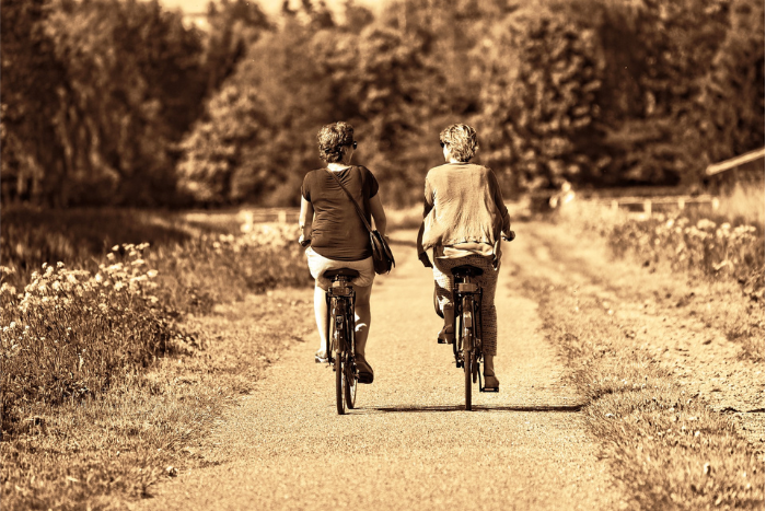 2 women bike riding